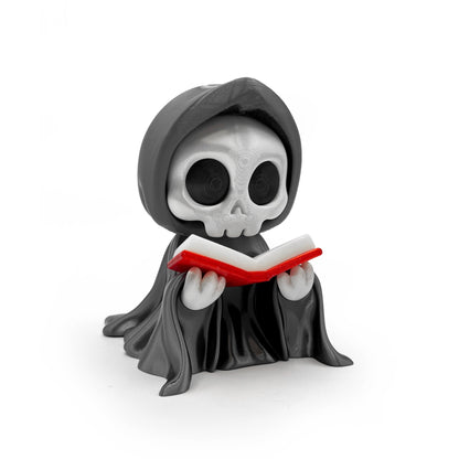 Giant Reading Reaper 3D printed grim reaper figure holding an open red book